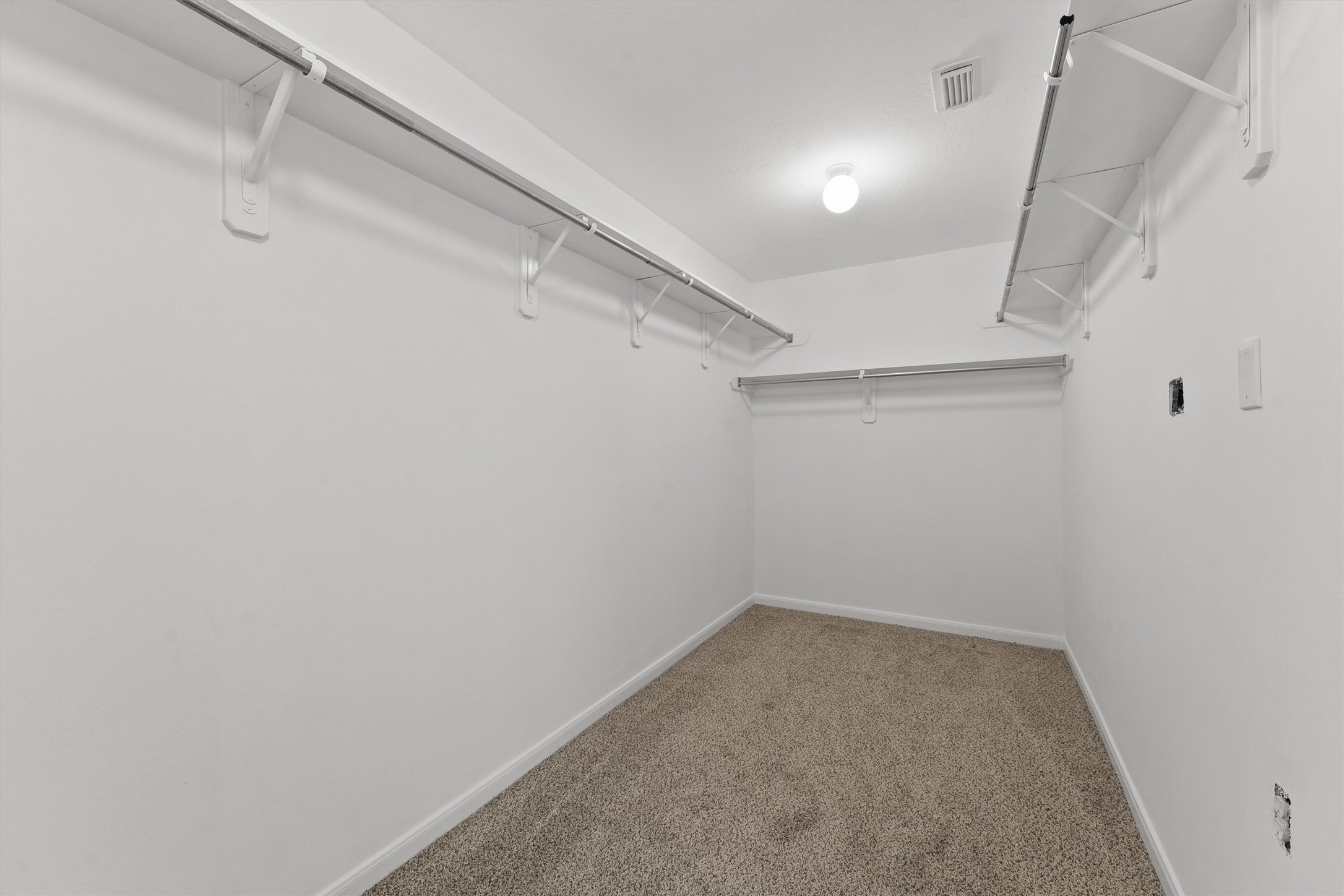 9107 Huckinston Court Spring, TX 77379 - Photo 27 of 32 a view of a room with racks on the wall