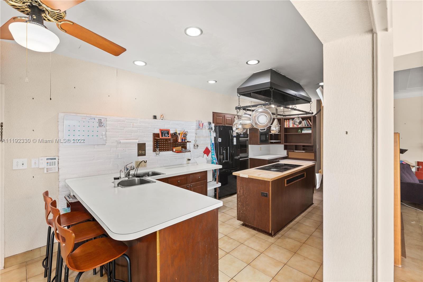 Riviera Coral Gables, FL 33146 - Photo 23 of 39 a kitchen with a stove a refrigerator and a sink