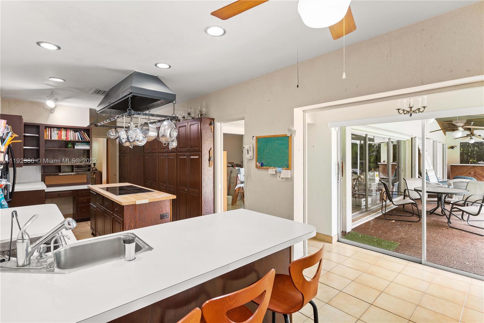 Riviera Coral Gables, FL 33146 - Photo 26 of 39 a kitchen with stainless steel appliances kitchen island granite countertop a sink and cabinets