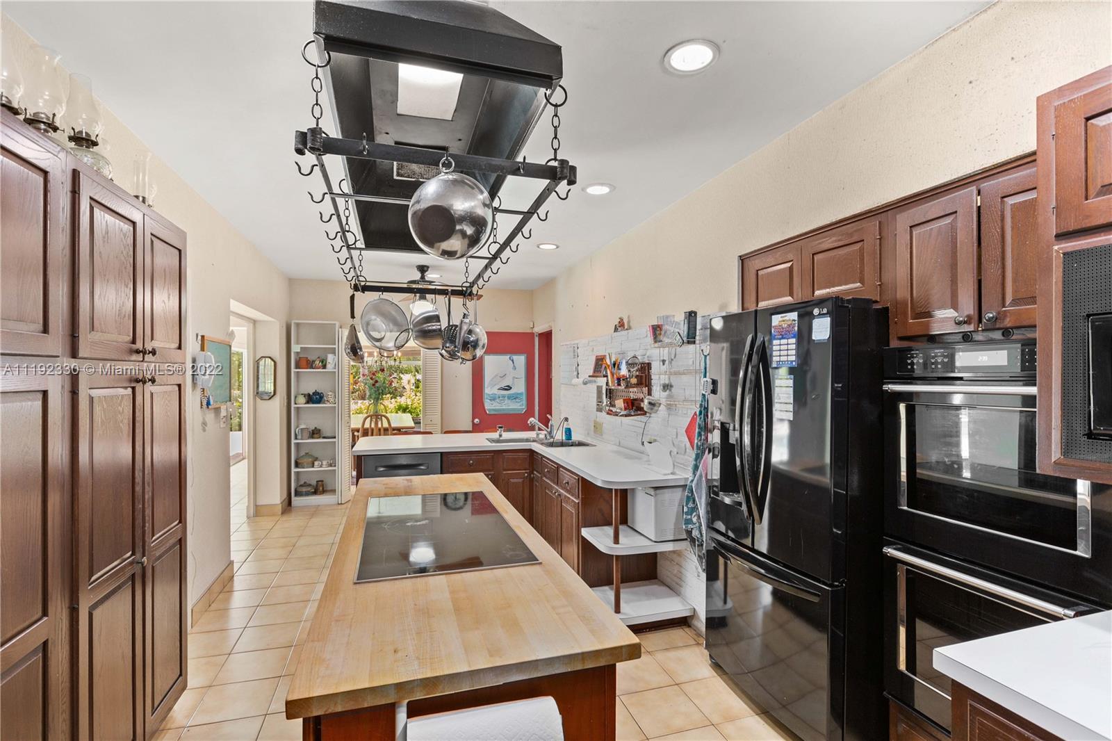 Riviera Coral Gables, FL 33146 - Photo 27 of 39 a kitchen with stainless steel appliances granite countertop a refrigerator stove and microwave