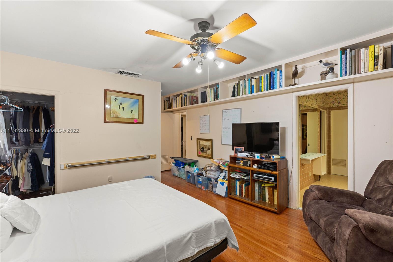 Riviera Coral Gables, FL 33146 - Photo 35 of 39 a bedroom with furniture and a flat screen tv