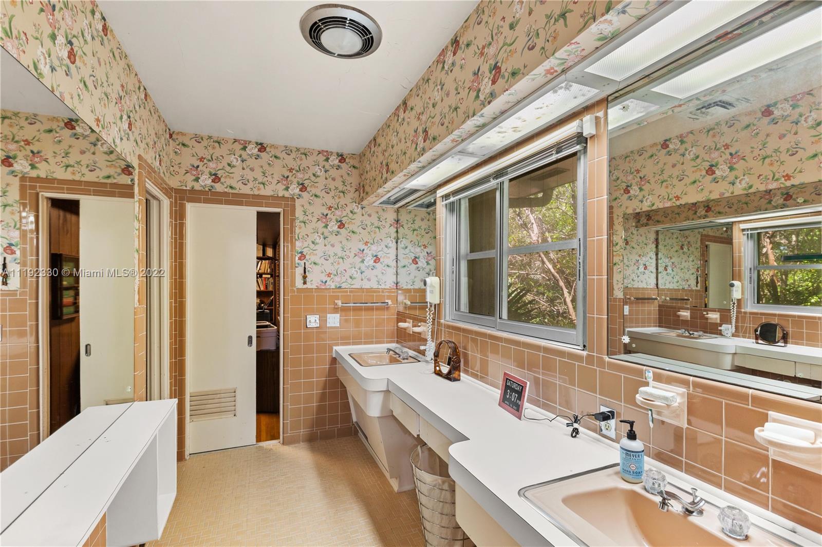 Riviera Coral Gables, FL 33146 - Photo 37 of 39 a bathroom with a tub sink and mirror