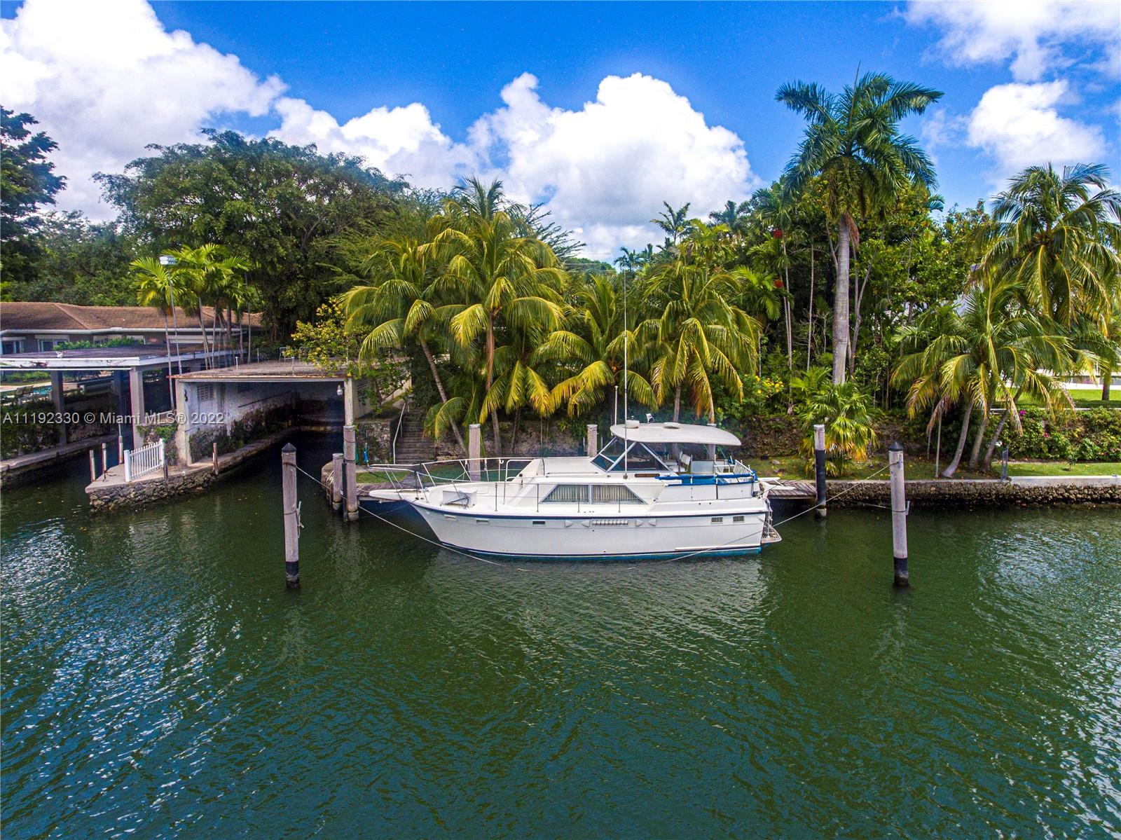 Riviera Coral Gables, FL 33146 - Photo 4 of 39 a view of a swimming pool with a table and chairs
