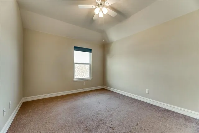 a spacious bathroom with a double vanity sink mirror and toilet