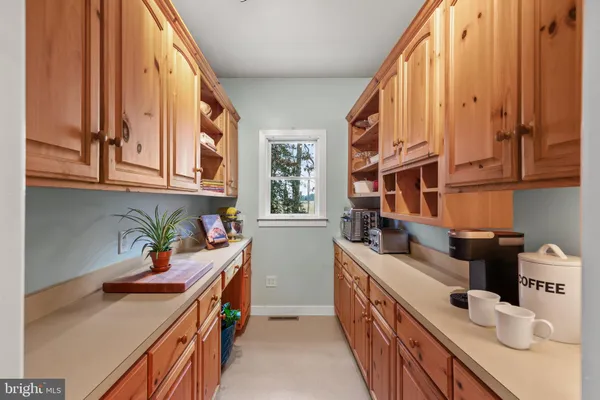 a bedroom with a bed chair and window