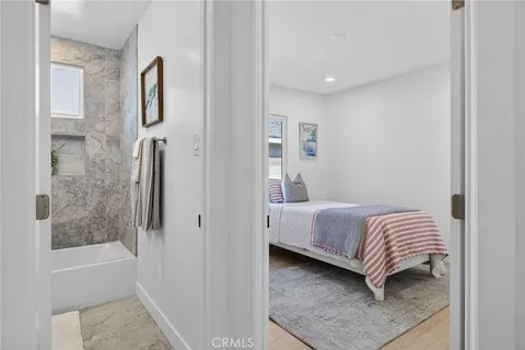 a bathroom with a bathtub and shower