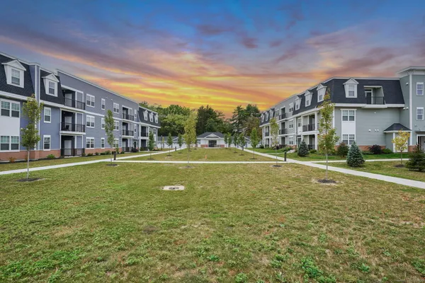 a view of a building with a big yard