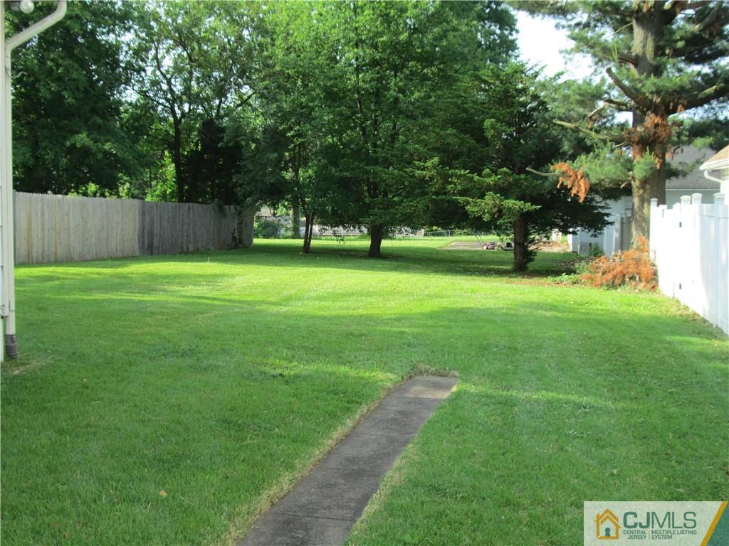 45 Holly Road Iselin, NJ 08830 - Photo 2 of 2 a view of a park with large trees