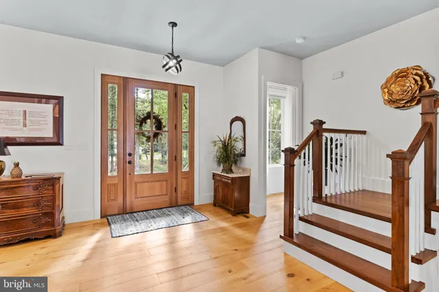 a living room with lots of furniture and kitchen view