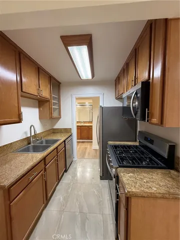 a white toilet and tub sitting next to a bathroom sink