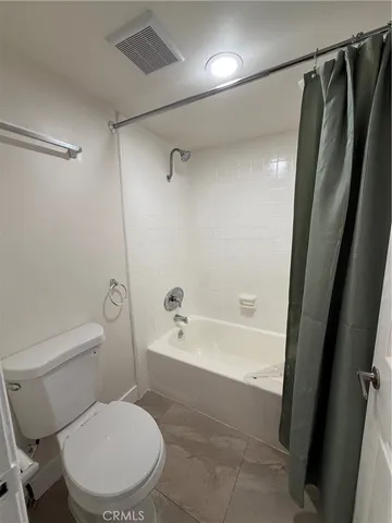 a bathroom with a tub and shower