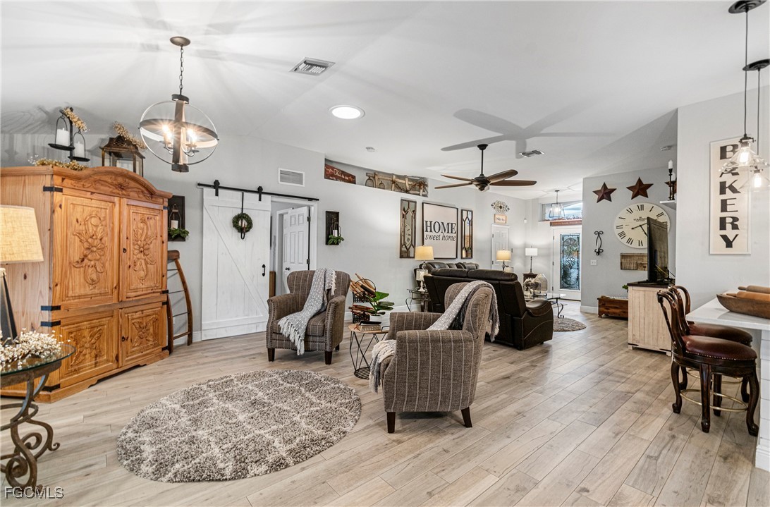 4656 Varsity Circle Lehigh Acres, FL 33971 - Photo 11 of 49 a view of a livingroom with furniture and a ceiling fan