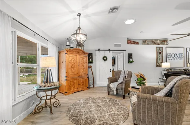 a living room with patio furniture and a window