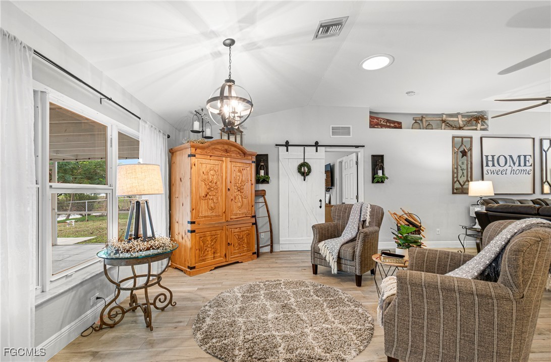 4656 Varsity Circle Lehigh Acres, FL 33971 - Photo 12 of 49 a living room with patio furniture and a window