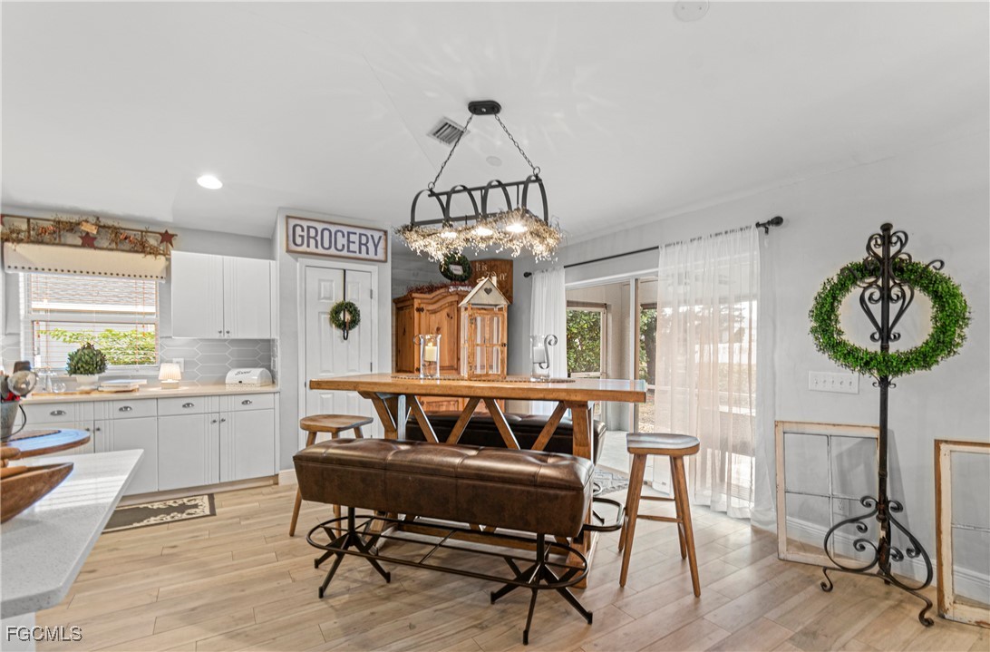4656 Varsity Circle Lehigh Acres, FL 33971 - Photo 14 of 49 a view of a livingroom with furniture and a table