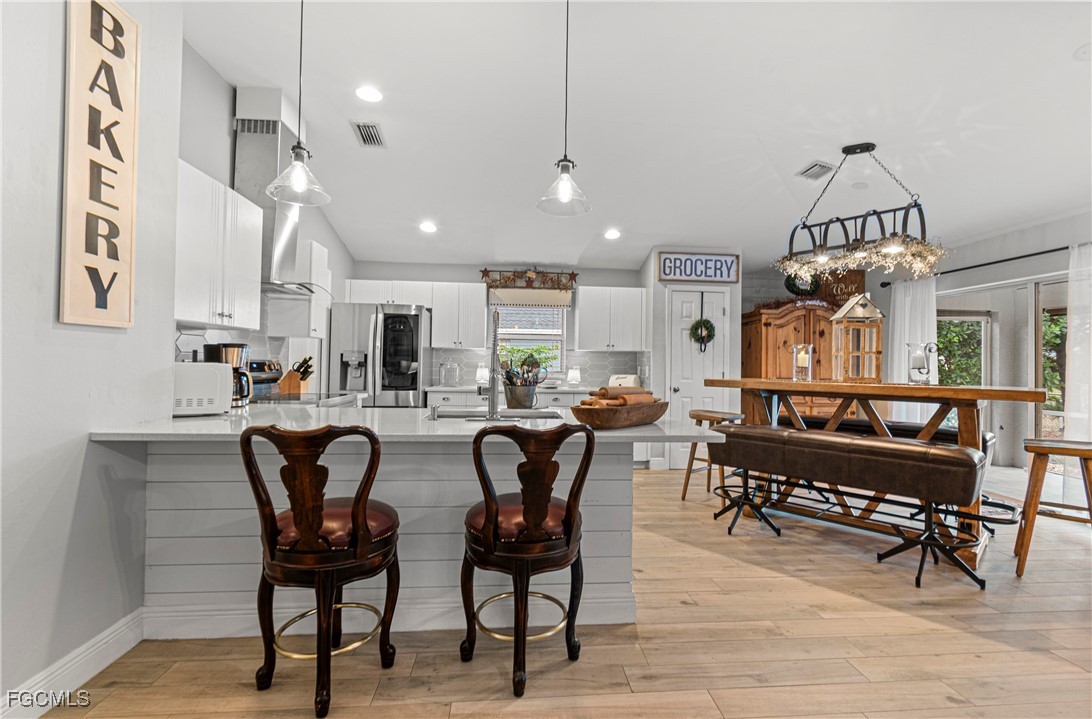 4656 Varsity Circle Lehigh Acres, FL 33971 - Photo 15 of 49 a view of a dining room with furniture