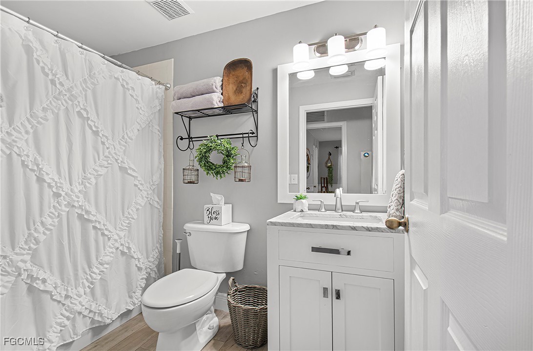 4656 Varsity Circle Lehigh Acres, FL 33971 - Photo 28 of 49 a bathroom with a sink toilet and shower