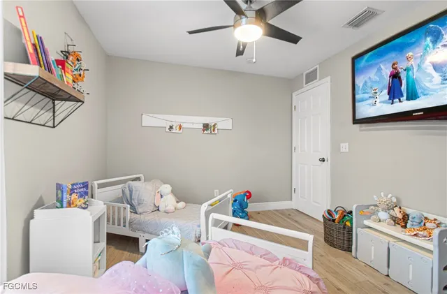 a living room with furniture and baby toys