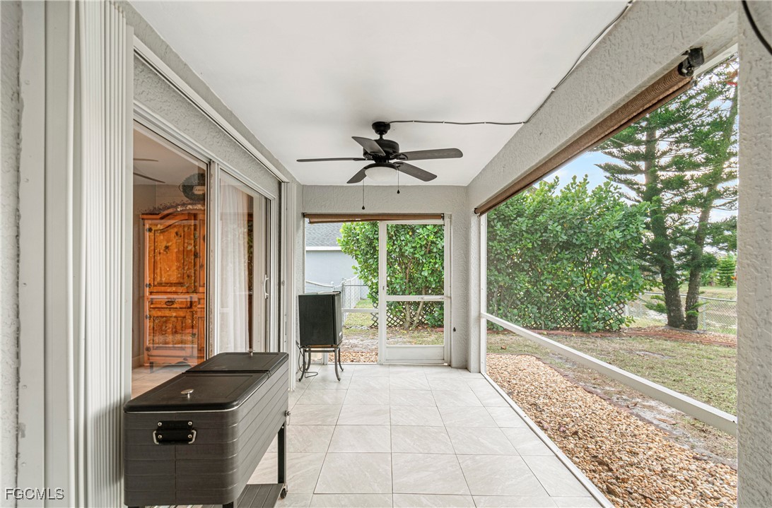 4656 Varsity Circle Lehigh Acres, FL 33971 - Photo 36 of 49 a view of a porch with furniture and a yard