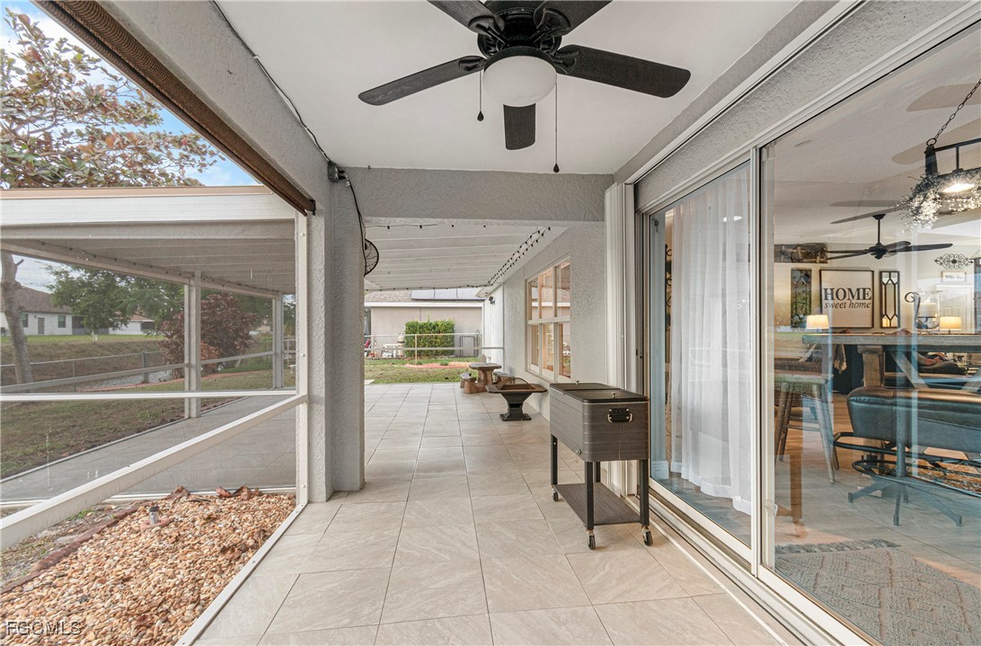 4656 Varsity Circle Lehigh Acres, FL 33971 - Photo 38 of 49 a view of a hallway with living room and dining room