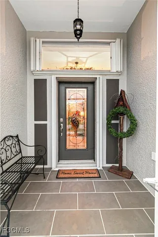 a view of a livingroom with furniture and front door