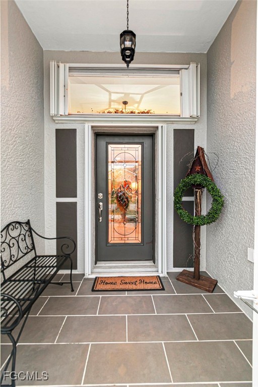 4656 Varsity Circle Lehigh Acres, FL 33971 - Photo 5 of 49 a view of a livingroom with furniture and front door