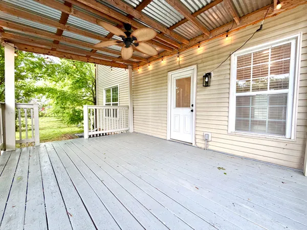 a view of a backyard with a small cabin