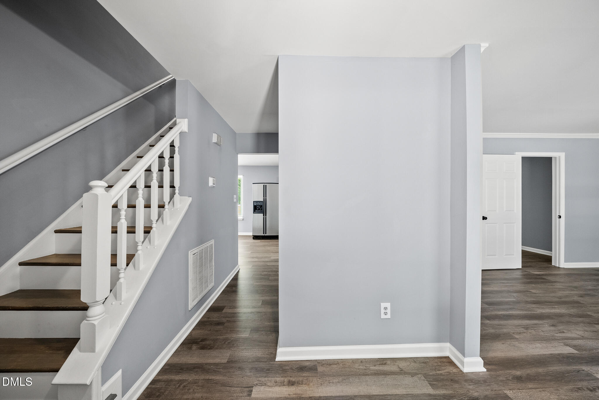 2108 Treverton Place Raleigh, NC 27609 - Photo 15 of 30 a view of a hallway with wooden floor and entryway