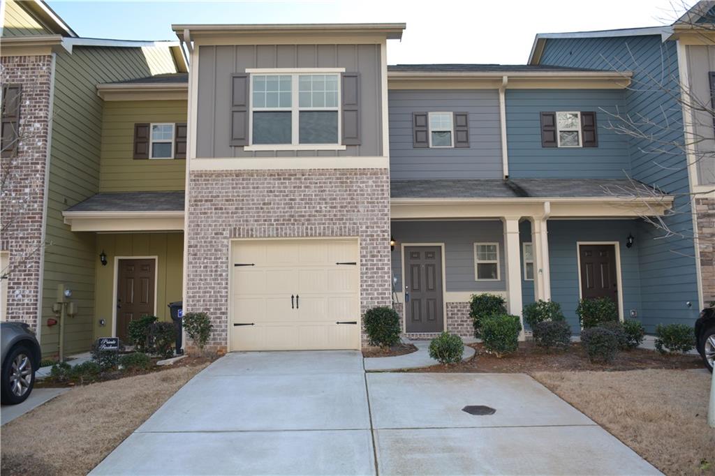 183 Spring Way Square Canton, GA 30114 - Photo 1 of 29 a front view of a house with yard