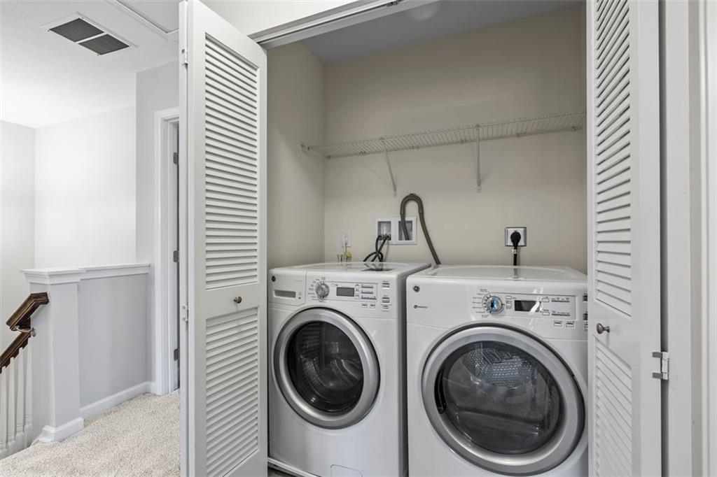 1402 Pointe View Drive Mars, PA 16046 - Photo 19 of 25 a view of a hallway with washer and dryer