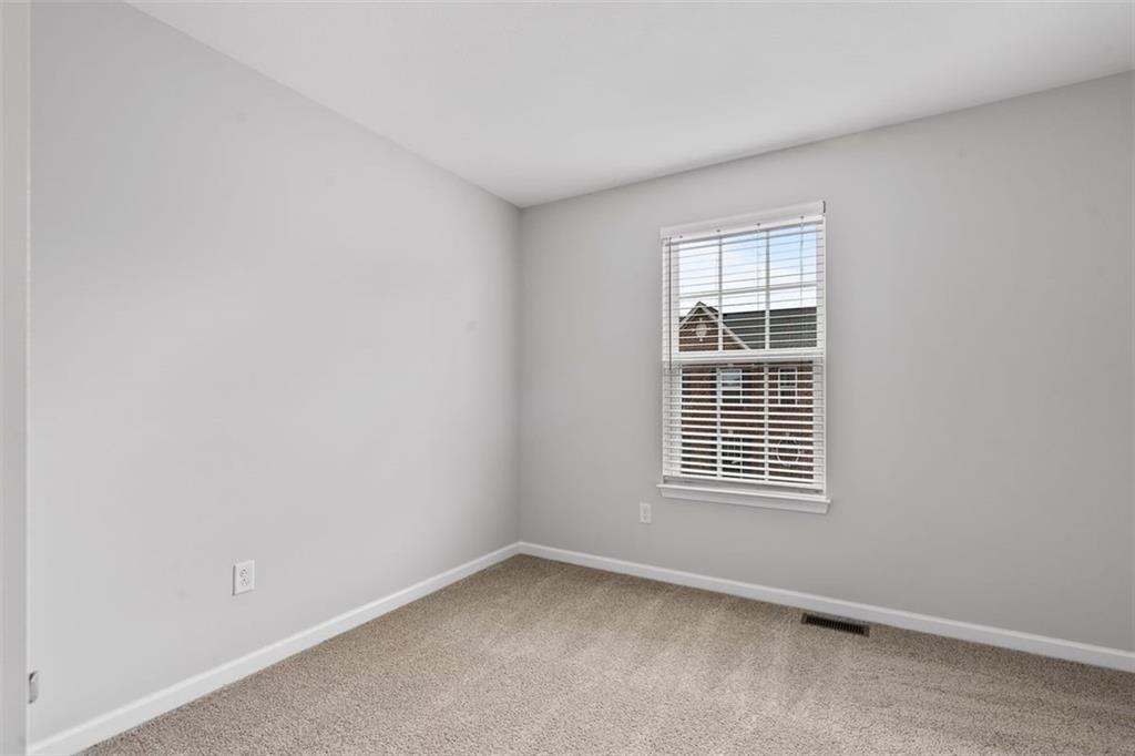 1402 Pointe View Drive Mars, PA 16046 - Photo 20 of 25 a view of an empty room with a window
