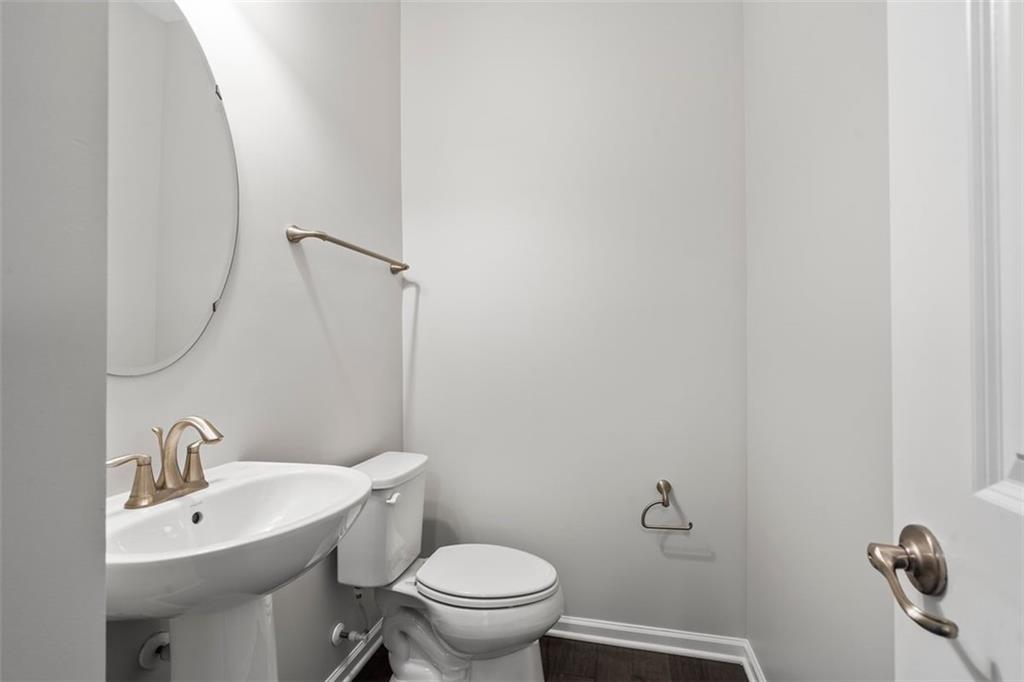 1402 Pointe View Drive Mars, PA 16046 - Photo 8 of 25 a bathroom with a toilet sink and mirror