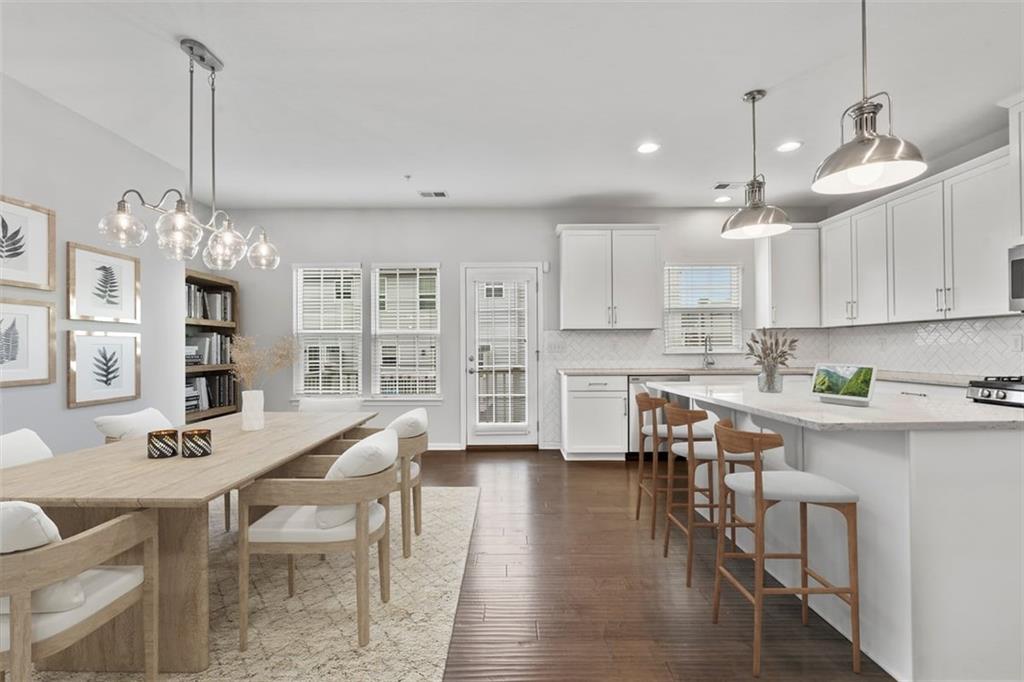 1402 Pointe View Drive Mars, PA 16046 - Photo 9 of 25 a view of a dining room and livingroom with furniture wooden floor kitchen chandelier