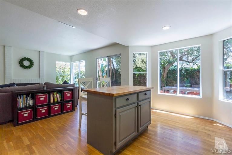 560 Fairfield Road Simi Valley, CA 93065 - Photo 14 of 32 a kitchen with granite countertop a stove and a sink