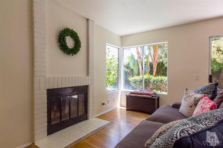 560 Fairfield Road Simi Valley, CA 93065 - Photo 16 of 32 a bedroom with a bed and a fireplace