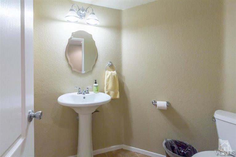 560 Fairfield Road Simi Valley, CA 93065 - Photo 18 of 32 a bathroom with a sink mirror and toilet