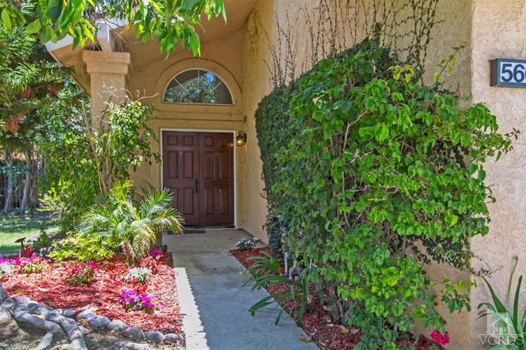 560 Fairfield Road Simi Valley, CA 93065 - Photo 3 of 32 a front view of a house with a garden