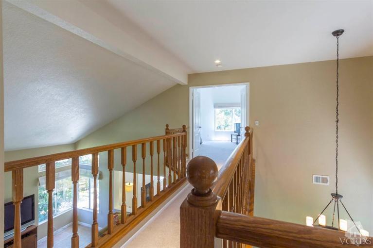 560 Fairfield Road Simi Valley, CA 93065 - Photo 21 of 32 a view of hallway with furniture and stairs
