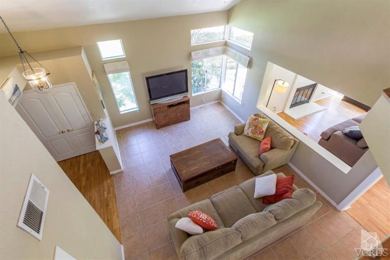 560 Fairfield Road Simi Valley, CA 93065 - Photo 22 of 32 a living room with furniture and a flat screen tv