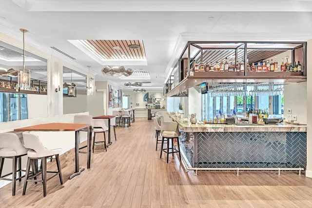 a living room with furniture rug and window