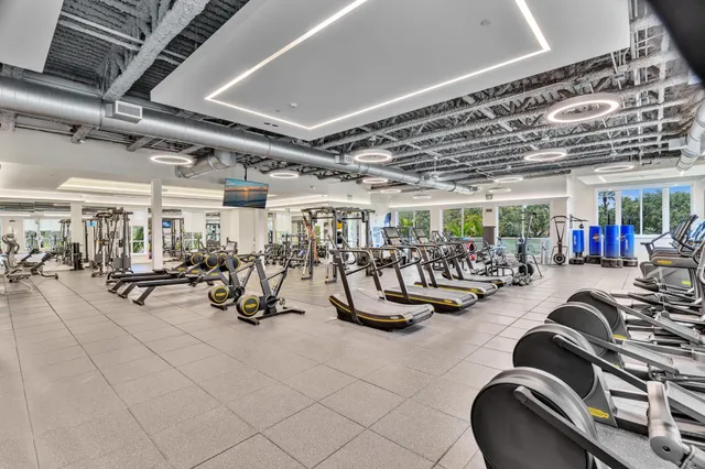 a kitchen with stainless steel appliances granite countertop a sink and a stove top oven