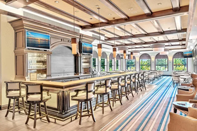 a bathroom with a sink a mirror a toilet and shower