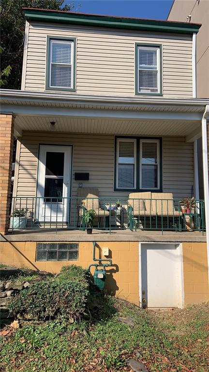 4 Neff Street Pittsburgh, PA 15211 - Photo 12 of 12 a front view of a house with yard and sitting area