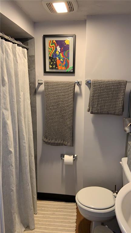 4 Neff Street Pittsburgh, PA 15211 - Photo 5 of 12 a bathroom with a toilet and a shower