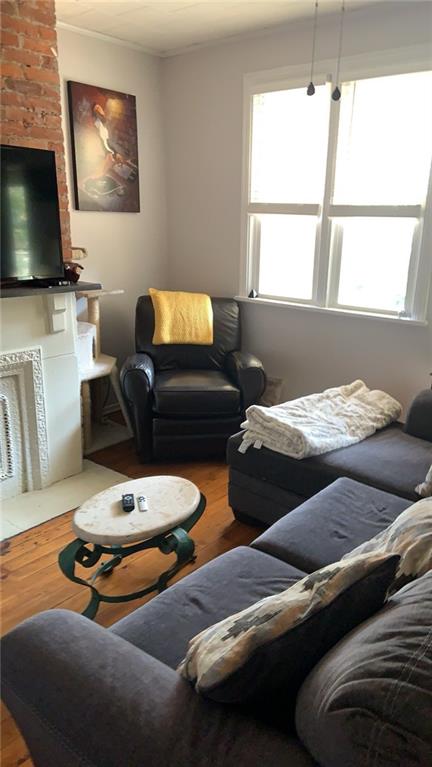 4 Neff Street Pittsburgh, PA 15211 - Photo 7 of 12 a bedroom with furniture a flat screen tv and a window