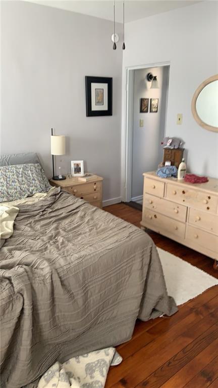 4 Neff Street Pittsburgh, PA 15211 - Photo 9 of 12 a bedroom with a bed and wooden floor