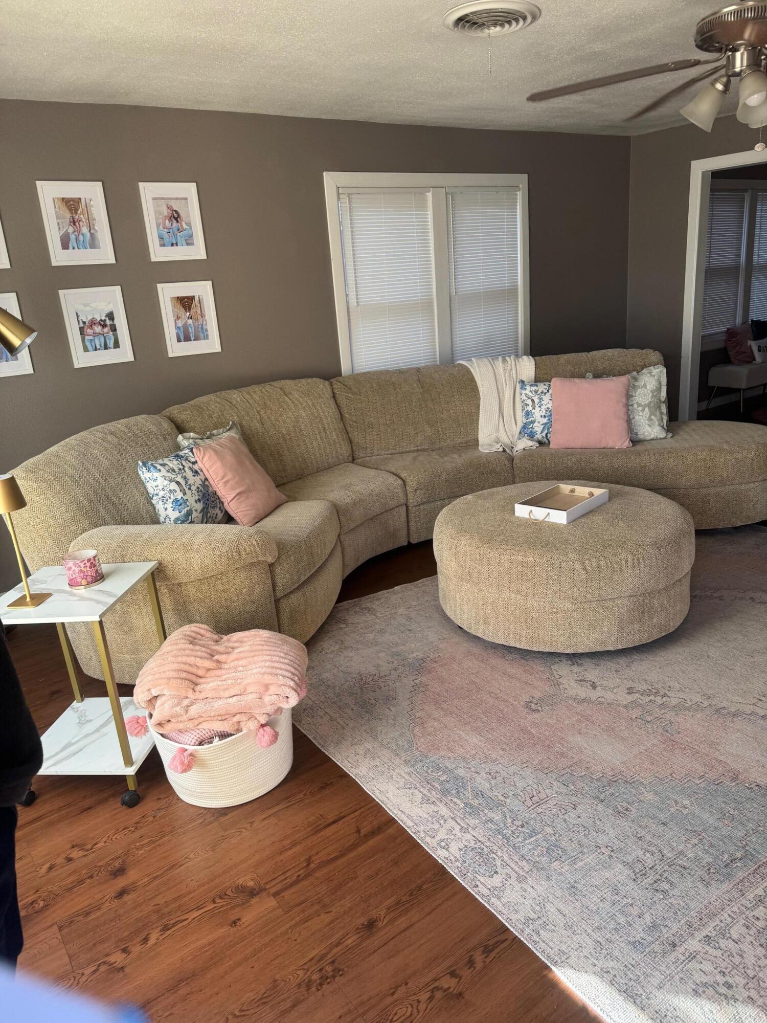 2312 15th Street Lubbock, TX 79401 - Photo 2 of 20 a living room with furniture and painting on the wall