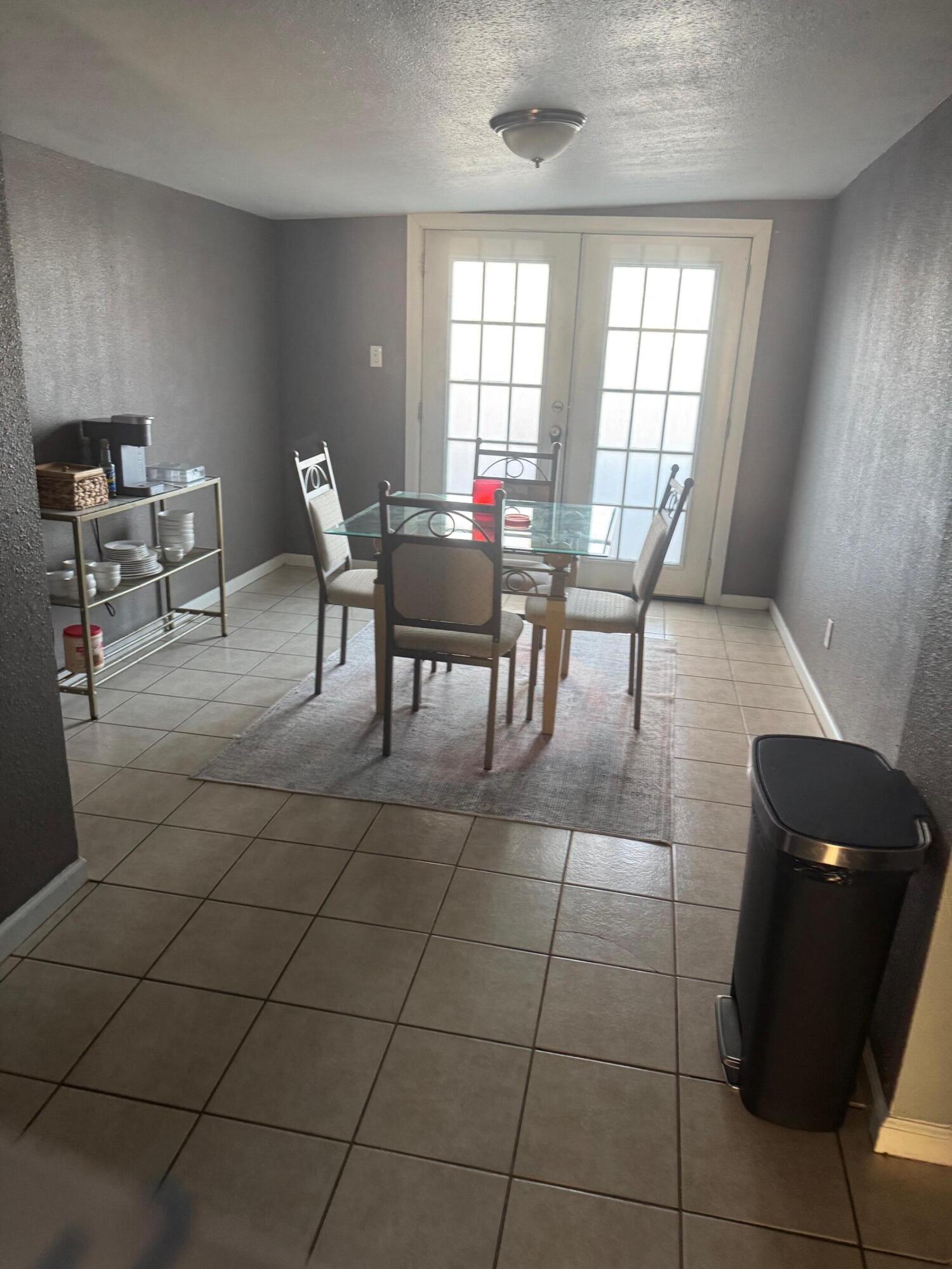 2312 15th Street Lubbock, TX 79401 - Photo 4 of 20 a view of a dining room with furniture and window
