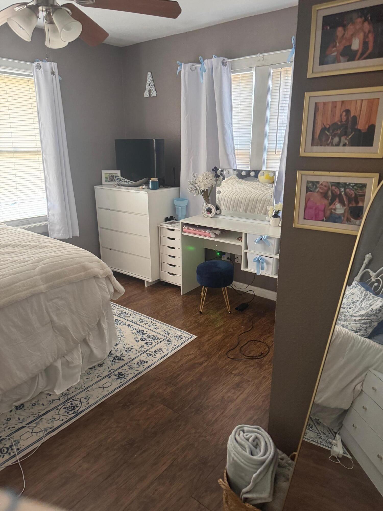2312 15th Street Lubbock, TX 79401 - Photo 7 of 20 a bedroom with a bed and a window