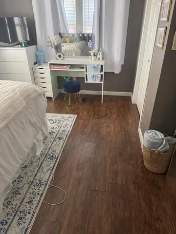 a living room with a couch and a rug